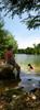 	Hiker and Dog Wading at Red Bud Isle - Lady Bird Lake - Austin - Texas