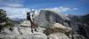 	Hiker on North Dome under Half Dome - Yosemite